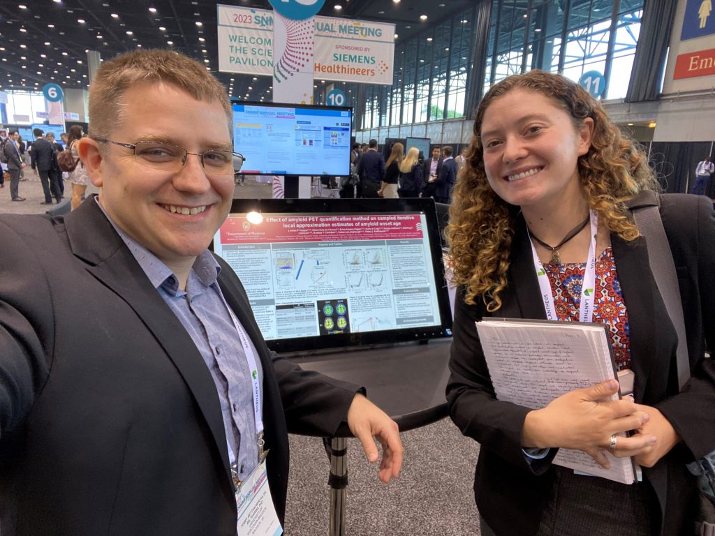 Left to Right: Tobey Betthauser, Jordan Teague. Standing in front of Jordan Teague's research poster at SNMMI 2023.