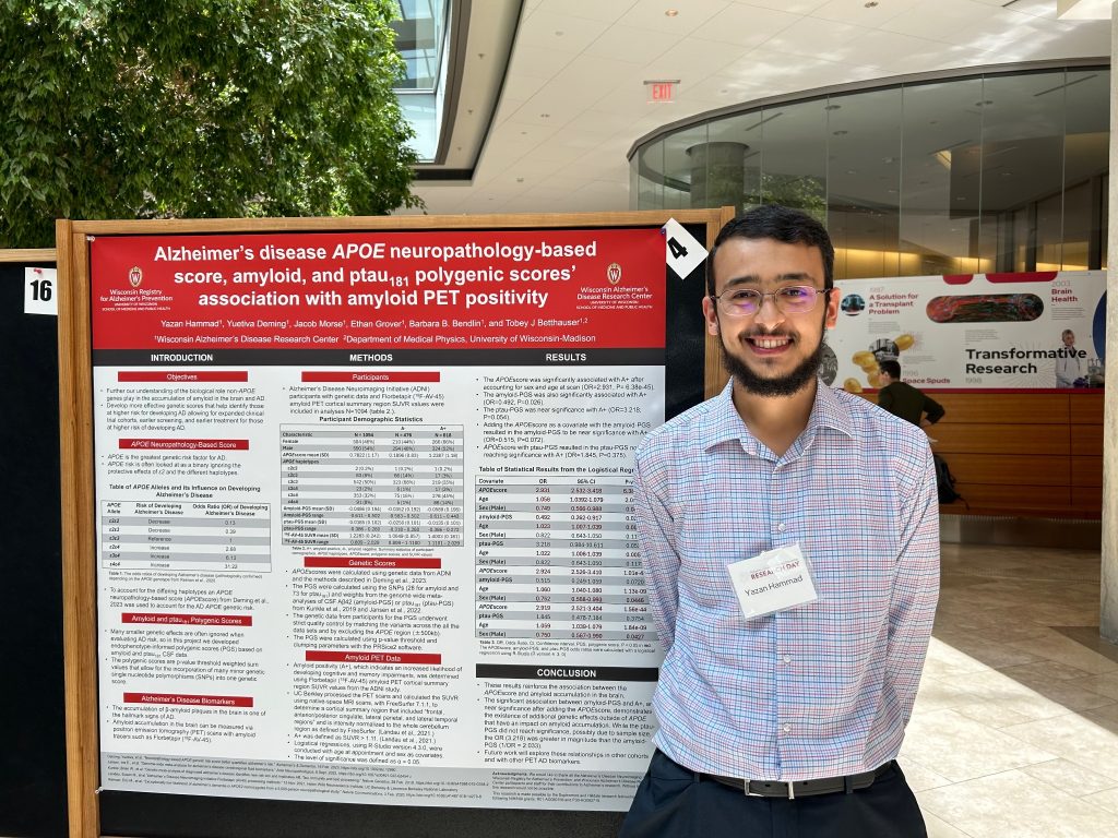 Yazan Hammad standing in front of research poster at ADRD 2024.