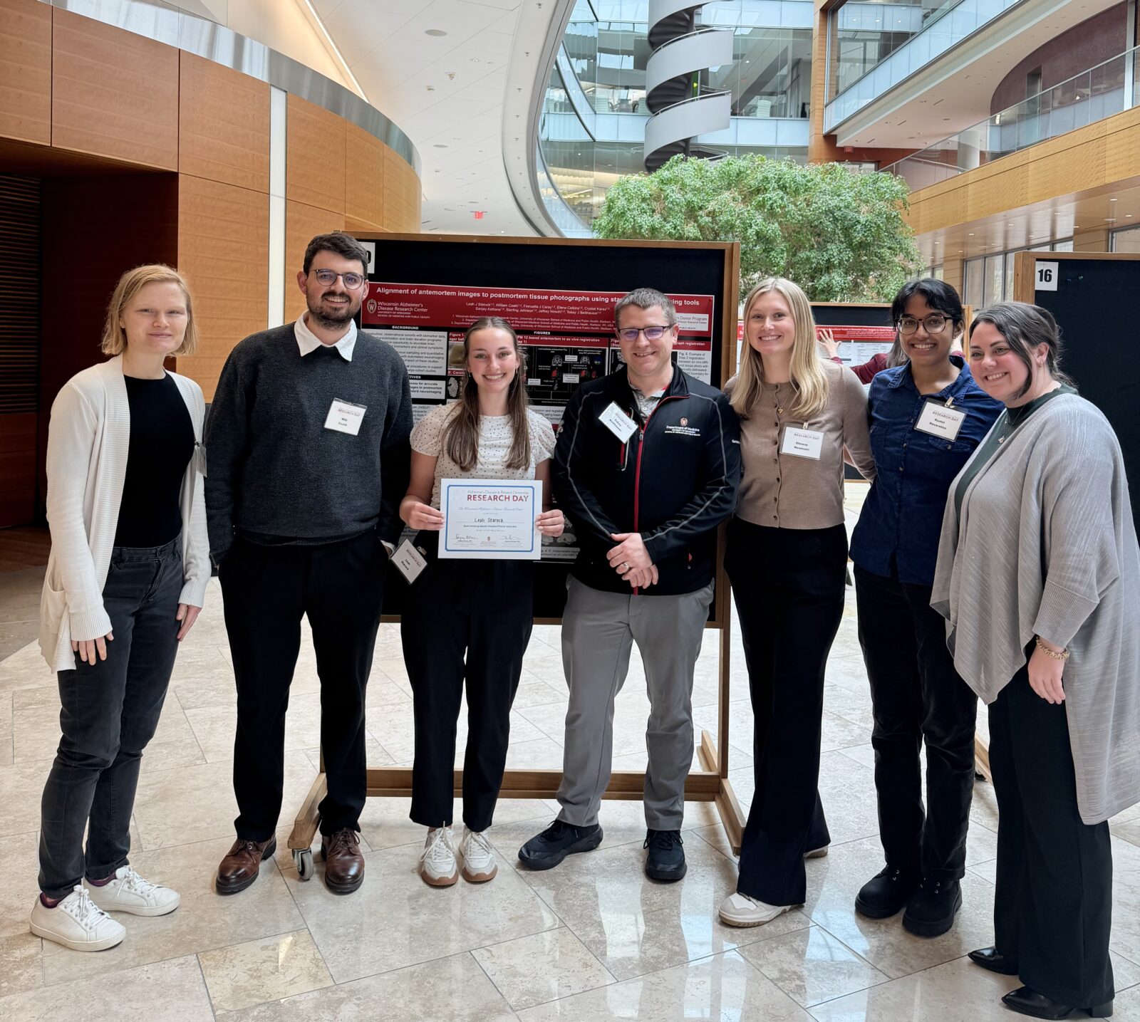 Group photo stood in front of a research poster at ADRD 2026.
Left to Right: Hailey Bruzzone, Will Coath, Leah Staruck, Tobey Betthauser, Simone Nowinski, Ruvini Navaratna, Finnuella Carey